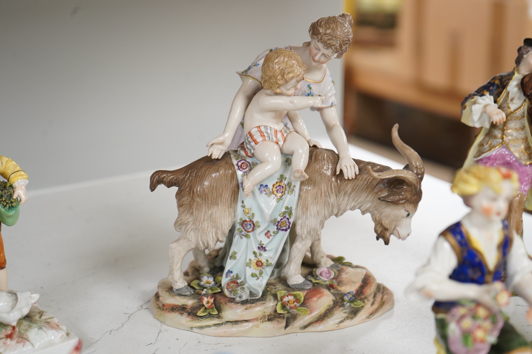 Two Derby porcelain seated figures emblematic of summer and autumn and a collection of Continental porcelain figures to include a pair of recumbent cows, largest 18cm high